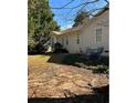 Spacious backyard with a wood patio and a table and chairs, perfect for outdoor entertaining and relaxation at 413 Remington Ct, Villa Rica, GA 30180