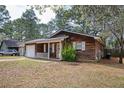 Charming home with a front porch, well-kept lawn, and an adjacent driveway at 6347 Steepleridge Ct, Riverdale, GA 30296
