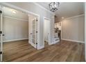 Welcoming foyer with hardwood floors, a study, and staircase leading to the second level at 167 Pinewood Dr, Covington, GA 30014