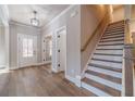 Spacious foyer with natural light, hardwood floors, and stairs to the upper level at 167 Pinewood Dr, Covington, GA 30014