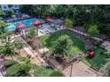 Aerial view of outdoor common area with seating, pergolas, and well-maintained landscaping at 795 Hammond Dr # 1108, Atlanta, GA 30328