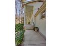 Exterior view of the home showing the columns and walkway that lines the front of the house at 1497 Mason Mill Ne Rd, Atlanta, GA 30329