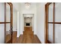 Inviting foyer with hardwood floors, chandelier and view of the fireplace at 446 Cove Ne Dr, Marietta, GA 30067