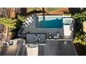Aerial view of a stunning home with a pool, spa, and outdoor seating area at 230 Hardscrabble Rd, Roswell, GA 30075