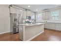 The kitchen showcases granite countertops, stainless steel appliances, and ample cabinet space at 3030 Westpoint Cir, Snellville, GA 30078