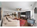 Inviting living room featuring a comfortable sectional sofa and a large flat-screen TV at 1011 Dogwood Forest Ne Dr, Marietta, GA 30068