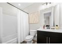 Well-lit bathroom featuring modern fixtures, vanity, and shower-tub combination at 269 Castleberry Station Dr, Atlanta, GA 30313