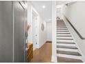 Bright entryway with hardwood floors and staircase leading to the upper level at 269 Castleberry Station Dr, Atlanta, GA 30313