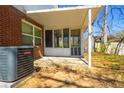 Enclosed back porch featuring a screen wall and concrete foundation at 2742 Bomar Rd, Douglasville, GA 30135