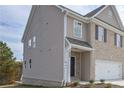Side view of a two-story home with stone and siding exterior at 2960 Fareed St, Douglasville, GA 30135
