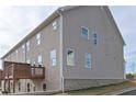 Rear exterior view of two-story home with a wooden deck at 2960 Fareed St, Douglasville, GA 30135