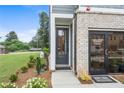 Close-up of the Sales Center entrance, showcasing professional landscaping and clear signage at 508 Red Terrace, Marietta, GA 30060