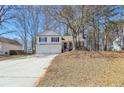 Charming two-story home with a two-car garage and a welcoming porch at 155 Hitchcock Dr, Villa Rica, GA 30180
