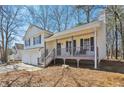 A charming house with a two-car garage and a cozy front porch at 155 Hitchcock Dr, Villa Rica, GA 30180