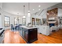Bright and spacious kitchen with stainless steel appliances, island, stone fireplace and eat-in kitchen area at 268 Hanson Way, Marietta, GA 30064