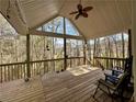 A spacious covered porch with comfortable seating and ceiling fan, perfect for relaxing outdoors at 401 Carrie Kathleen Ter, Carrollton, GA 30116