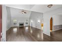 Bright living room featuring vaulted ceiling, hardwood floors, fireplace, and natural light at 4956 Braeburn Nw Trce, Acworth, GA 30102