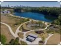 Beautiful aerial view of a park with a lake and walking trails near the city skyline at 19 Grove Park Nw Pl, Atlanta, GA 30318