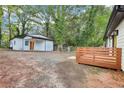 Spacious backyard featuring a large detached garage and deck space at 2910 3Rd Sw Ave, Atlanta, GA 30315