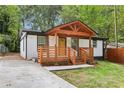 Charming renovated home featuring a covered front porch with beautiful wood beam and painted brick exterior at 2910 3Rd Sw Ave, Atlanta, GA 30315