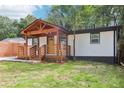 Charming renovated home featuring a covered front porch with beautiful wood beam and painted brick exterior at 2910 3Rd Sw Ave, Atlanta, GA 30315