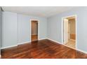 Bright living room with hardwood floors, neutral paint, and multiple doorways, offering a cozy atmosphere at 491 Bolton Nw Rd, Atlanta, GA 30331