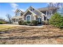 Beautifully landscaped home with well manicured bushes and healthy dormant grass at 931 New Bedford, Marietta, GA 30068