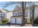 Charming home featuring a two-car garage, stone accents, neutral siding and a welcoming front entrance at 946 Gardenia Curv, Canton, GA 30114