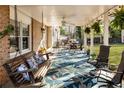 Inviting covered patio with comfortable seating and charming decor at 6784 Tilton Ln, Peachtree Corners, GA 30360