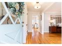 Foyer featuring hardwood floors, stylish decor, and a view into other rooms at 3605 Wood Valley Ne Ct, Brookhaven, GA 30319