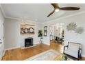 Spacious living room with fireplace, hardwood floors, and arched doorway at 966 Tilden Nw St, Atlanta, GA 30318