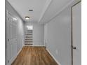 Finished basement hallway with vinyl floors and access to a utility room at 4373 Sun Valley Blvd, Atlanta, GA 30344