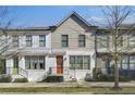 Charming townhome featuring a painted brick facade, colorful doors, well-maintained landscaping, and a welcoming entrance at 1181 Rambler Cross, Atlanta, GA 30312