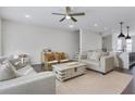 Comfortable living room featuring neutral decor, stylish furnishings, an open layout, and plenty of natural light at 1181 Rambler Cross, Atlanta, GA 30312