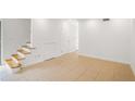 Versatile room with neutral tile, staircase, and ample space for various uses at 3077 Colonial Way # F, Atlanta, GA 30341