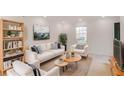 Bright living room featuring neutral decor, stylish furniture, and ample natural light at 3077 Colonial Way # F, Atlanta, GA 30341
