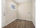 An entry room features wood-style floors, bright natural light from window, and utility hookups at 2254 Whites Mill Rd, Decatur, GA 30032