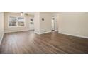 A brightly lit living room features new flooring, neutral paint, and bright natural light at 2254 Whites Mill Rd, Decatur, GA 30032