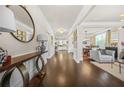 Bright foyer with hardwood floors, decorative console table, and open view into other living areas at 4826 Ralin Ct, Atlanta, GA 30331