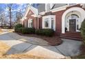 Close-up of the front entrance, showcasing the arched doorway and walkway at 2758 Chieftain Run, Duluth, GA 30097