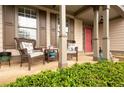 Cozy front porch with seating, offering a welcoming entrance to the home at 1976 Hedge Brooke Nw Trl, Acworth, GA 30101