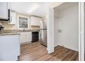 Well-lit kitchen with stainless steel appliances and modern countertops at 3409 Glensford Dr, Decatur, GA 30032