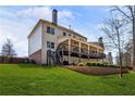 Expansive backyard featuring a multi-level deck perfect for outdoor entertaining at 3845 Williams Point Dr, Cumming, GA 30028