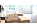 Bright kitchen featuring quartz countertops, modern appliances, and an island for extra space at 1067 Crest Mill Dr, Marietta, GA 30008