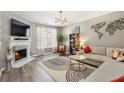 Cozy living room with a fireplace, plush sofa, stylish decor, and ample natural light at 3736 Chattahoochee Summit Se Dr # 20, Atlanta, GA 30339