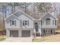 Charming two-story home features a two-car garage and a welcoming front porch at 186 Brandi Dr, Hiram, GA 30141