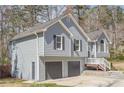 Gray two-story home with a two-car garage and a well-manicured front yard at 186 Brandi Dr, Hiram, GA 30141