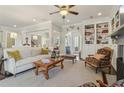 Inviting living room with built-in shelving, comfortable seating, and neutral color palette at 4224 Dogwood Bend Park, Duluth, GA 30096