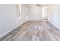 Bright living room featuring new grey tone flooring and neutral paint at 803 Denise Sw Ct, Stone Mountain, GA 30087