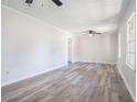 Bright living room featuring new grey tone flooring and neutral paint at 803 Denise Sw Ct, Stone Mountain, GA 30087
